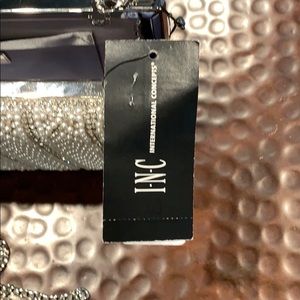 Silver studded clutch